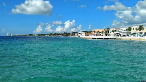 Scenic view of sea against blue sky