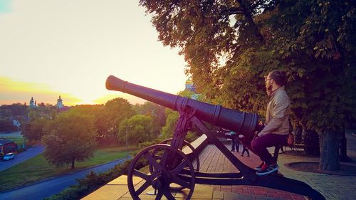 Woman on bicycle at sunset