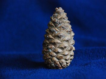 Close-up of ice cream on table against blue background