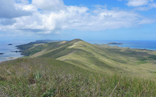 Scenic view of mountains and sea against sky