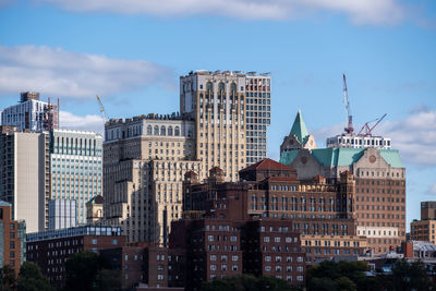 Buildings in city against sky