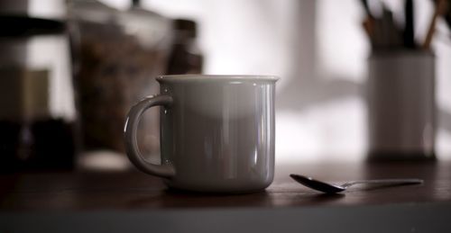 Close-up of coffee cup on table