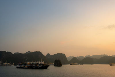 Scenic view of sea against clear sky during sunset