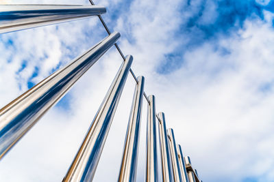 Low angle view of metal structure against sky