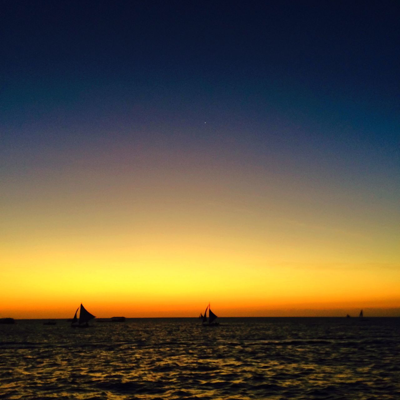 sea, water, sunset, transportation, nautical vessel, horizon over water, waterfront, mode of transport, boat, scenics, tranquility, tranquil scene, beauty in nature, sailing, orange color, sailboat, nature, copy space, clear sky, idyllic