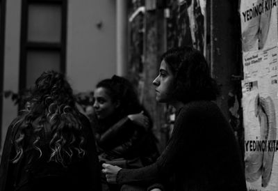 Side view of a young woman looking away