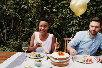 Smiling couple enjoying food