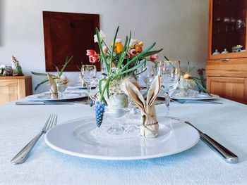 Eating utensils arranged on dining table at home