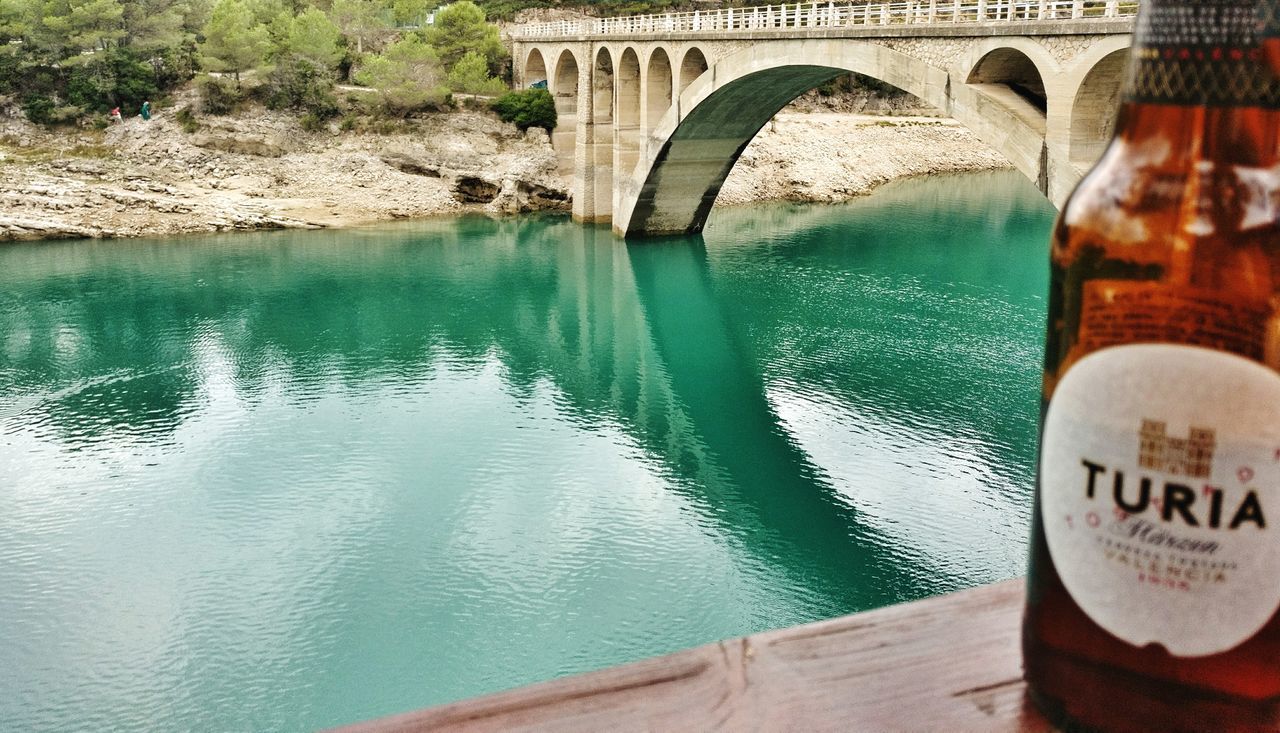 bridge - man made structure, water, connection, arch, architecture, river, built structure, day, transportation, no people, riverbank, outdoors, nature, close-up, sky