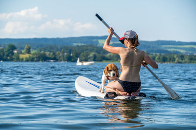 Full length of woman on boat in sea