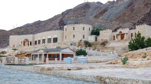 Exterior of old building by mountain