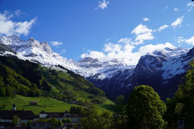 Scenic view of snowcapped mountains against sky