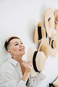 Home decor and interior design. straw hats like interior decorate the walls in apartment