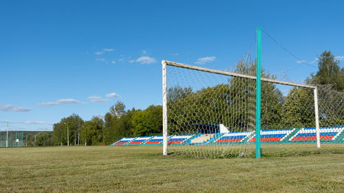 Soccer field against blue sky
