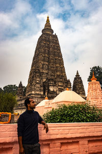 Man standing against temple