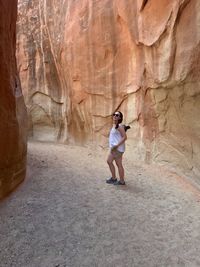 Full length of woman standing on rock