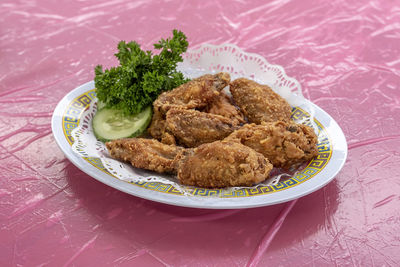 Close-up of meat served in plate on table