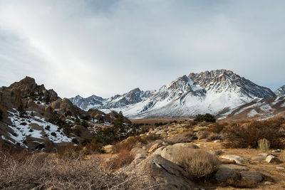 Scenic view of snowcapped mountains against sky