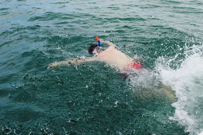 Man swimming in sea