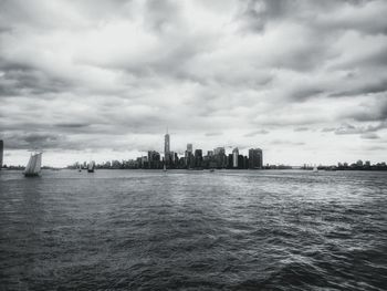 City skyline against cloudy sky
