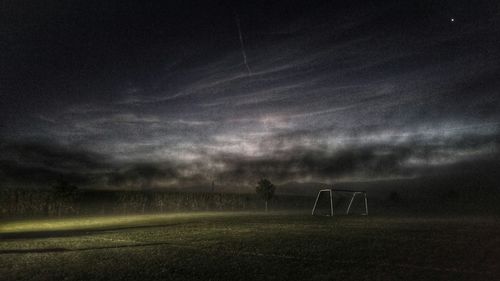 Field against cloudy sky