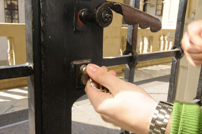 Close-up of hand holding machine