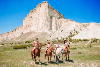 Group of people riding horses