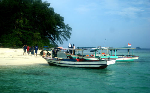 People on boat in sea