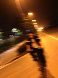 Blurred motion of cars on road at night