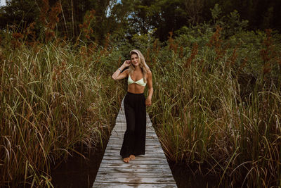 Full length of woman standing on field