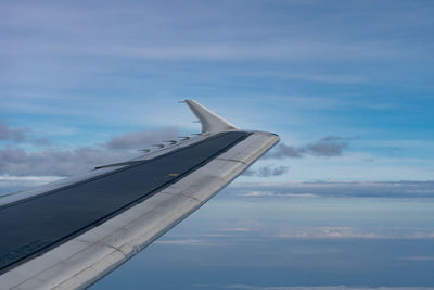 Airplane flying over blue sky