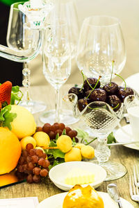 Fruits in glass on table