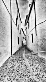 Street amidst buildings against sky