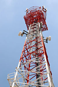 Low angle view of communications tower against sky