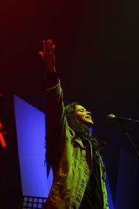 Midsection of woman with illuminated lighting equipment