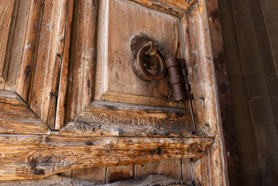 Low angle view of carving on door