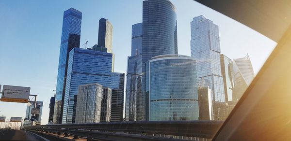 Low angle view of modern buildings against sky in city