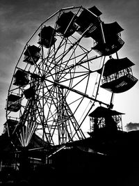 Low angle view of ferris wheel against sky