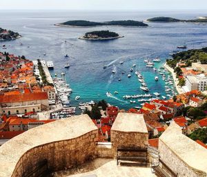 High angle view of buildings by sea