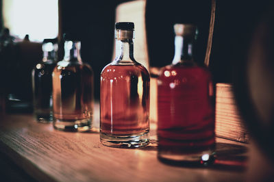 Close-up of wine bottles on table