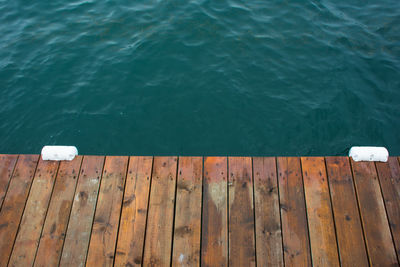 High angle view of wooden pier over sea
