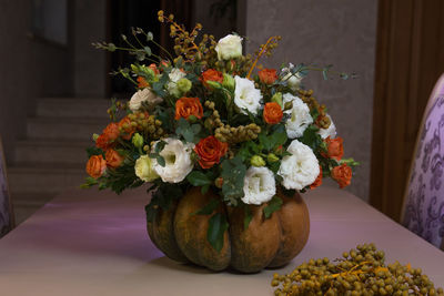 Close-up of flower vase on table