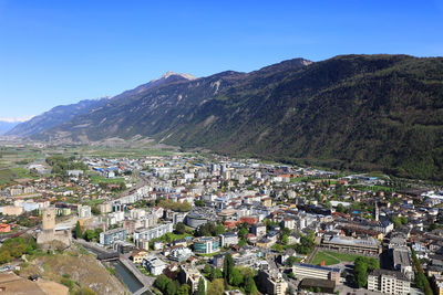 Aerial view of town against clear sky