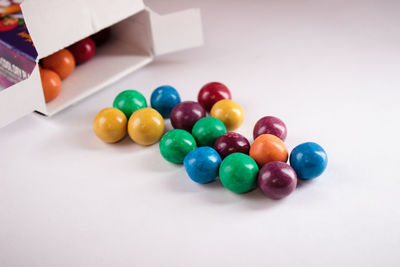 High angle view of multi colored balls on table