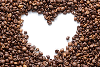 Directly above shot of coffee beans against white background