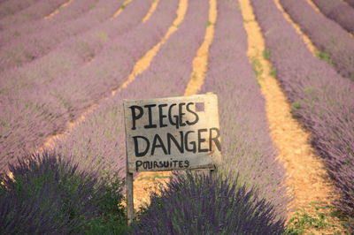 Warning sign on agricultural field