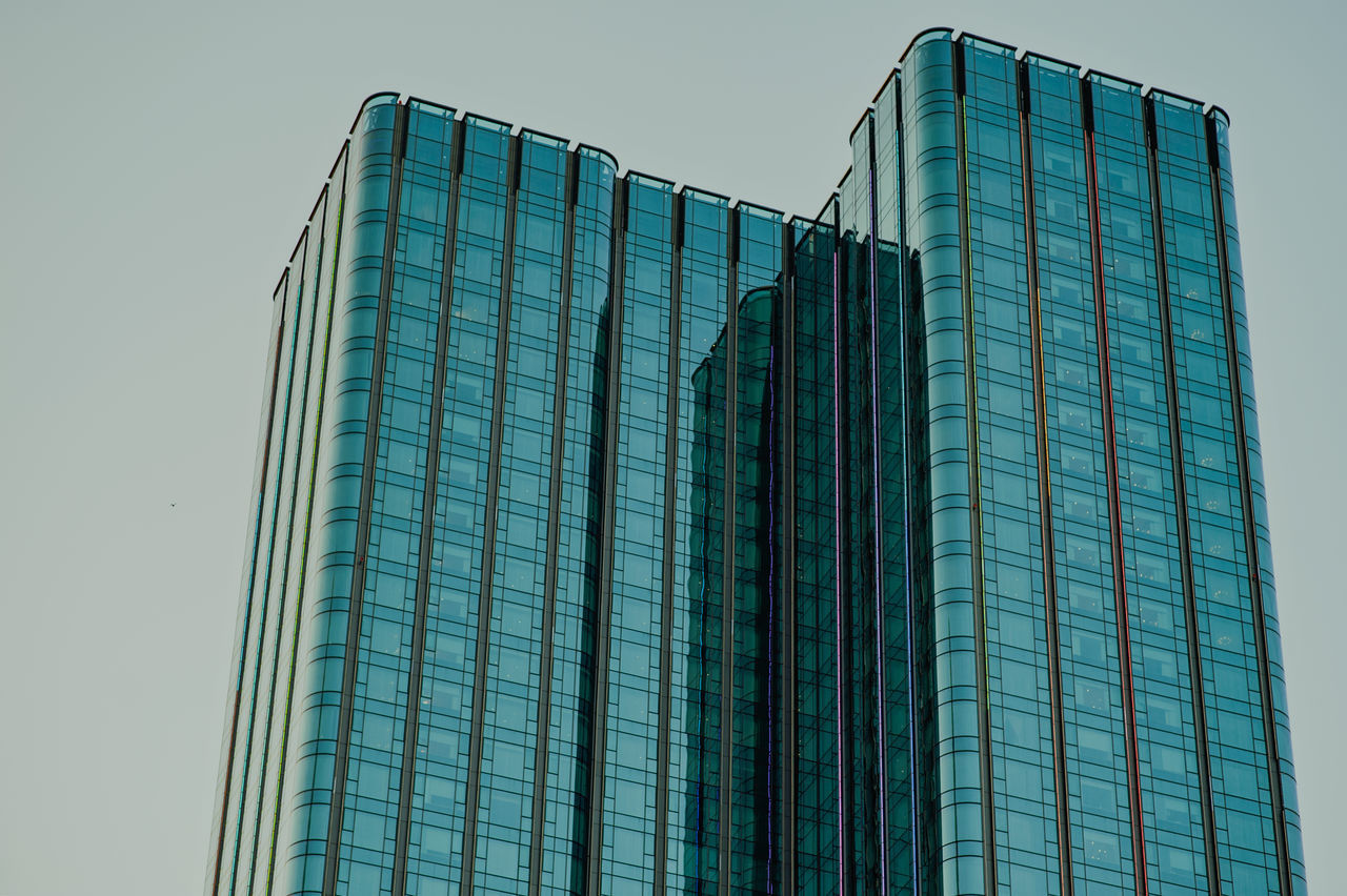 LOW ANGLE VIEW OF OFFICE BUILDING AGAINST CLEAR SKY