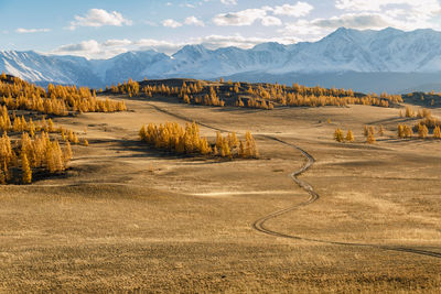 Scenic view of landscape and mountains against sky