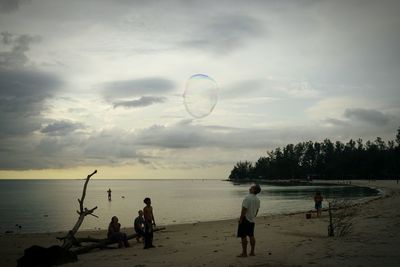 People enjoying at beach