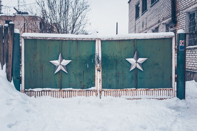 Text on snow against building